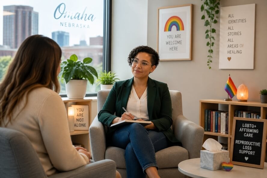 A therapist and client having a supportive conversation in a bright, comfortable counseling office.